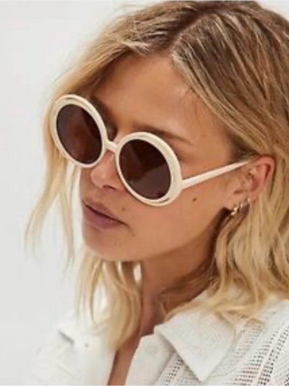 Wavy Baby Round Sunglasses from Free people.